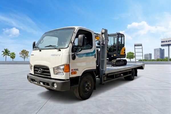 Xe ô tô nâng đầu chở máy Hyundai W11XL chở 6 tấn sàn dài 5m8